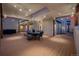 Expansive outdoor deck features dining area, string lights, and hot tub with views at 1764 Mesa Ridge Ln, Castle Rock, CO 80108