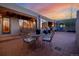 Cozy outdoor patio with comfortable seating, a swing and views creating a relaxing outdoor space at 1764 Mesa Ridge Ln, Castle Rock, CO 80108