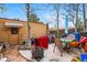 View of the backyard with an outdoor patio, red towel, grill, and shed at 12458 E Kansas Pl, Aurora, CO 80012