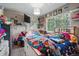 Bedroom with multi-colored walls and bed at 12458 E Kansas Pl, Aurora, CO 80012