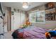 Carpeted bedroom with a window, closet and shelving at 12458 E Kansas Pl, Aurora, CO 80012
