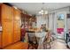 Dining room with wood floors and view of exterior at 12458 E Kansas Pl, Aurora, CO 80012