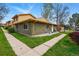 Exterior view of home with green grass and sidewalks at 12458 E Kansas Pl, Aurora, CO 80012