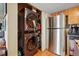 Convenient indoor laundry featuring modern washer and dryer set near stainless steel refrigerator at 12458 E Kansas Pl, Aurora, CO 80012
