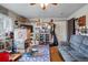 Cozy living room with ceiling fan and door to exterior at 12458 E Kansas Pl, Aurora, CO 80012