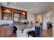 Stylish home bar with granite countertop, custom cabinets, and a wine fridge at 15857 E Aberdeen Ave, Centennial, CO 80016