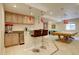 Basement wet bar with stainless mini-fridge and view of the pool table in the recreation area at 15857 E Aberdeen Ave, Centennial, CO 80016