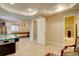 Finished basement featuring tile floors, recessed lighting, and an open doorway to an adjacent bathroom at 15857 E Aberdeen Ave, Centennial, CO 80016