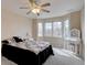 Bright bedroom with bay window and a vanity, offering a relaxing space with natural light and comfort at 15857 E Aberdeen Ave, Centennial, CO 80016
