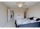Bedroom with a ceiling fan and seamless access to a walk-in closet and bathroom at 15857 E Aberdeen Ave, Centennial, CO 80016