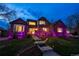 Stunning home with landscape lighting showcasing a brick facade, bay window, and inviting entryway at 15857 E Aberdeen Ave, Centennial, CO 80016