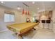 Spacious game room with a billiards table and bar area for entertainment at 15857 E Aberdeen Ave, Centennial, CO 80016