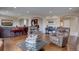 Bright and airy living room with hardwood floors and ample seating at 15857 E Aberdeen Ave, Centennial, CO 80016