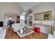 Bright living room with hardwood floors, a large mirror, and a view of the elegant foyer and dining area at 15857 E Aberdeen Ave, Centennial, CO 80016