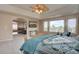 Spacious main bedroom with a view of the neighborhood and a sitting area at 15857 E Aberdeen Ave, Centennial, CO 80016