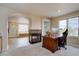 Home office with fireplace, hardwood floors, and natural light at 15857 E Aberdeen Ave, Centennial, CO 80016