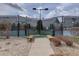 Tennis court entrance showing rules and benches; part of community recreational facilities at 15857 E Aberdeen Ave, Centennial, CO 80016
