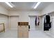Spacious walk-in closet with custom shelving and ample storage space, ideal for organizing wardrobes at 15857 E Aberdeen Ave, Centennial, CO 80016