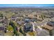 Stunning aerial view of a neighborhood highlighting the home's location and scenic surroundings at 12518 W 77Th Pl, Arvada, CO 80005