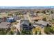 Stunning aerial view of home in a peaceful neighborhood with mountain backdrop at 12518 W 77Th Pl, Arvada, CO 80005