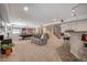 Finished basement with pool table and lounge area with two tvs at 12518 W 77Th Pl, Arvada, CO 80005
