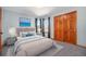 Cozy bedroom with natural light, neutral colors and closet at 12518 W 77Th Pl, Arvada, CO 80005