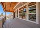Beautiful outdoor deck with wood ceiling and expansive windows at 12518 W 77Th Pl, Arvada, CO 80005