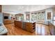 Spacious kitchen featuring a large center island and hardwood floors at 12518 W 77Th Pl, Arvada, CO 80005