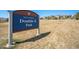 Sign for City of Arvada Double E Park, adjacent to grassy field, with residential homes in the background at 12518 W 77Th Pl, Arvada, CO 80005