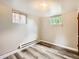 Bright bedroom with modern floors, recessed lighting, and natural light from the windows at 1856 S Steele St, Denver, CO 80210