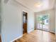 Dining area with hardwood floors and sliding door access to backyard deck at 1856 S Steele St, Denver, CO 80210