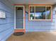 Close-up of the front door, showcasing its design and accompanied by a mailbox and window at 1856 S Steele St, Denver, CO 80210