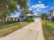 Charming single-story home with a well-maintained front yard and a long driveway at 1856 S Steele St, Denver, CO 80210