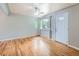 A bright living room with beautiful hardwood floors, a ceiling fan, and ample natural light at 1856 S Steele St, Denver, CO 80210