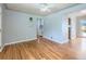 Inviting living room with hardwood floors, a ceiling fan, and natural light from the windows at 1856 S Steele St, Denver, CO 80210