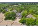 Aerial view of the home showcasing a golf course and lush green landscape at 2205 Santa Fe Dr, Longmont, CO 80504