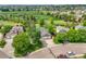Aerial view showcasing the beautifully landscaped yard, and close proximity to the golf course at 2205 Santa Fe Dr, Longmont, CO 80504