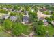 Aerial view of a home in a peaceful neighborhood featuring mature trees at 2205 Santa Fe Dr, Longmont, CO 80504