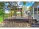 Deck with pergola overlooking a spacious backyard, perfect for outdoor entertaining and relaxation at 2205 Santa Fe Dr, Longmont, CO 80504
