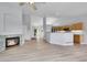 Spacious living room featuring a fireplace and an open floor plan into the kitchen at 2205 Santa Fe Dr, Longmont, CO 80504