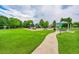 Community playground area with a playset, open green space, and picnic shelter at 2205 Santa Fe Dr, Longmont, CO 80504