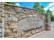 Pleasant Valley's stone entrance with a sign to indicate the neighborhood and HOA at 2205 Santa Fe Dr, Longmont, CO 80504