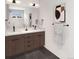 Modern bathroom with double vanity, stylish fixtures, and a walk-in shower at 4201 Wyandot St, Denver, CO 80211