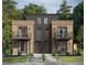 Modern townhouse with brick and gray facade, balconies, and well-manicured landscaping at 4201 Wyandot St, Denver, CO 80211