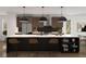 Spacious kitchen with large island, stainless steel appliances, and stylish pendant lighting at 4201 Wyandot St, Denver, CO 80211