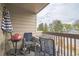 Covered balcony with outdoor seating, grill, and views of the surrounding neighborhood at 1470 S Quebec Way # 8, Denver, CO 80231