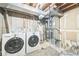 Basement with the washer and dryer, water heater and furnace at 1470 S Quebec Way # 8, Denver, CO 80231