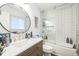 Modern bathroom with subway tile shower, sleek vanity, and contemporary round mirror at 1470 S Quebec Way # 8, Denver, CO 80231