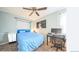 This bedroom features a ceiling fan and a dedicated desk area at 1470 S Quebec Way # 8, Denver, CO 80231