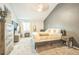 Bedroom featuring neutral colors, a large bed, and wooden dresser providing a relaxing atmosphere at 1470 S Quebec Way # 8, Denver, CO 80231